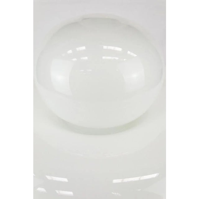 Electra ceiling light by Artemide, designed by Giuliana Gramigna in 1968. The white opaline glass diffuser rests on a...