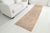This is a vintage Turkish Oushak rug from the Mid 20th Century. The piece was hand-knotted.