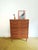 Vintage Danish teak chest of drawers from the 1950s with four drawers and integrated handles, featuring an elegant...