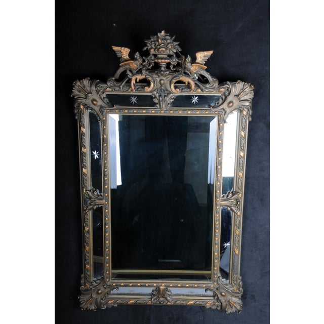 Antique historicism mirror, around 1870, gilded. Richly decorated mirror in historicism around 1870. Framed mirror with...