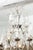 This exquisite vintage Louis XV chandelier features an elegant, multi-tiered silhouette adorned with an abundance of...