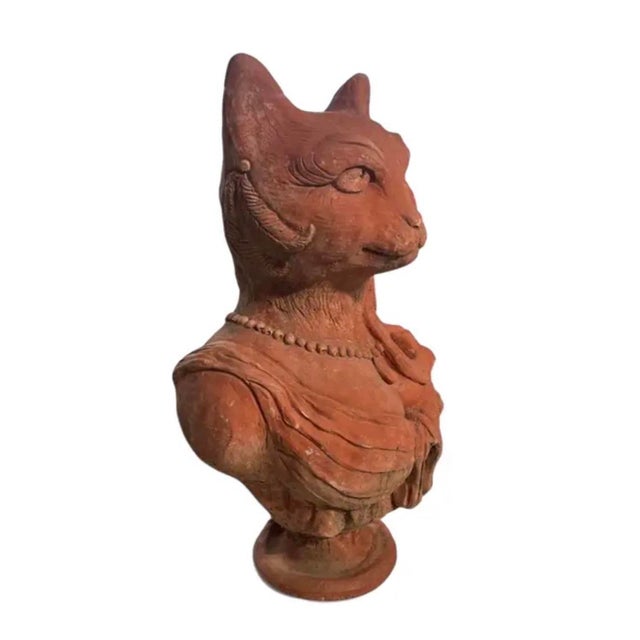 Add a unique, whimsical charm to your home decor or garden loggia with this striking vintage anthropomorphic cat bust...