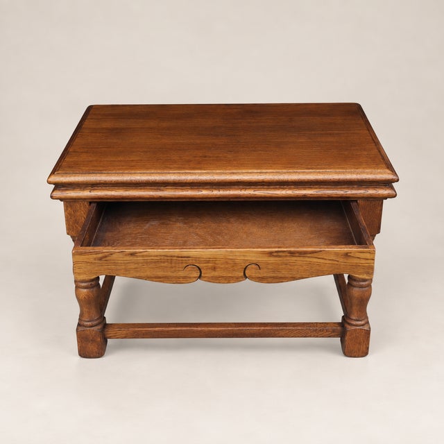 A charming circa 1940s English oak writing desk by Castle Furniture, retaining its original maker’s label. The compact...