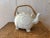 Vintage elephant-shaped teapot! This charming white teapot has lovely stylized detailing and a rattan handle. The perfect...