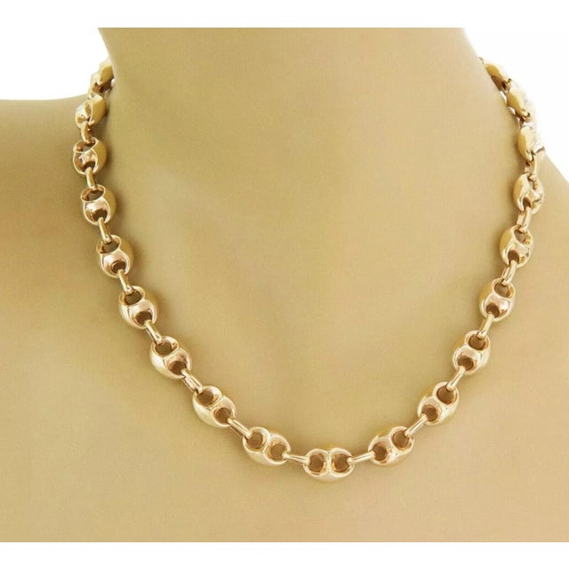 This beautiful classic style necklace is crafted from 14k yellow gold featuring fancy puffed style mariner links, each...