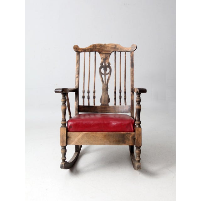 This early-1900s farmhouse rocking chair exudes a quiet, inviting charm. The gently carved back splat and turned spindles...
