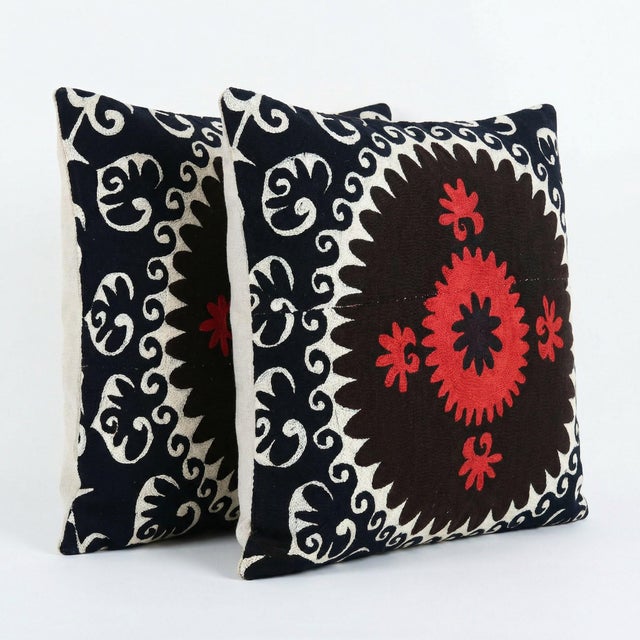 This beautiful 24'' x 24'' hand-embroidered Suzani pillow cover set was made from authentic Uzbek cotton fabric. The...
