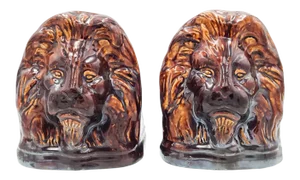 Rockingham Treacle Brown Glazed Lion Portraits, a Pair