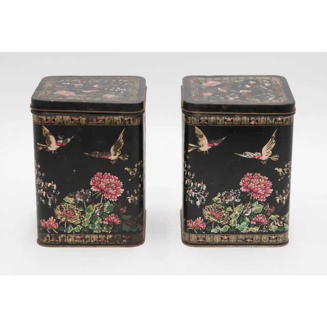 A lovely pair of 19th-Century French chinoiserie tole tea tins or kitchen canisters. These stylish tea tins are hand...