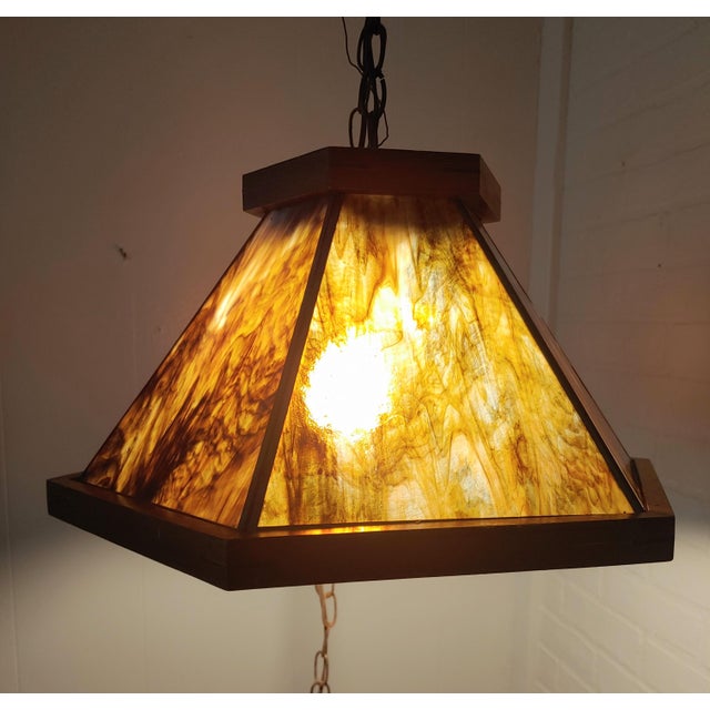 Here's a finely made pendant light featuring a walnut frame and 6 slag glass inserts. This is an Arts & Crafts Style circa...