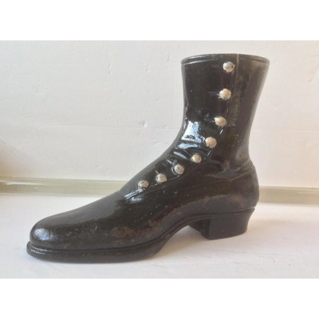 Charming antique cast iron boot with original paint and open bottom for mounts.