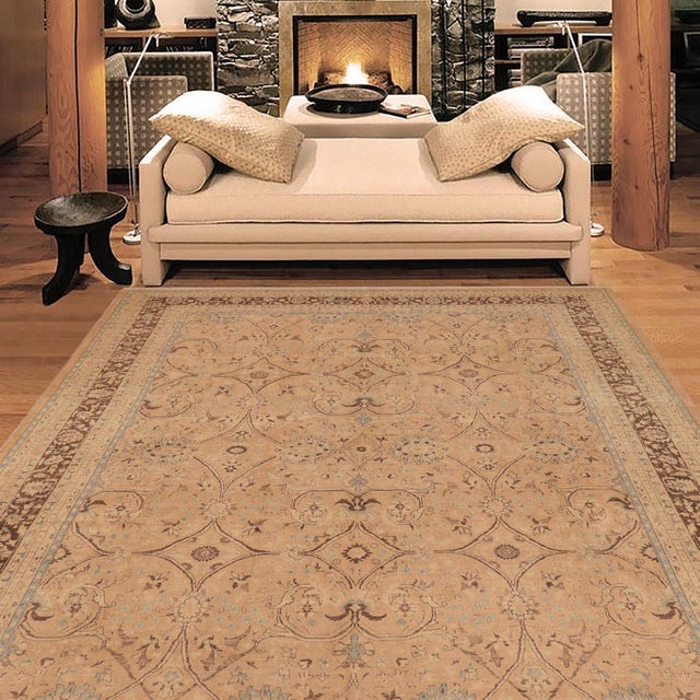 Enhance the ambiance of your home with this magnificent Persian-influenced Turkish hand-knotted rug made by skilled...