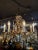 Vintage Brass & Crystal Eight Light French Style Chandelier with Center Pineapple Motif. Very fine condition and in fully...