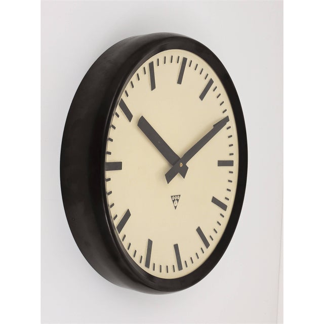 A big loft or industrial wall clock from the 1940s. straight and beautiful design, with a domed clocks face, the housing...