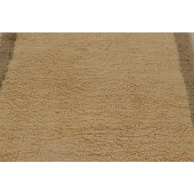 Made with hand-knotted high-pile wool in Turkey, this 4x4 vintage Tulu rug is a distinguished addition to Rug & Kilim’s...