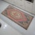 This authentic hand-knotted Tashpinar rug features a striking geometric medallion and a weathered, sun-faded aesthetic....