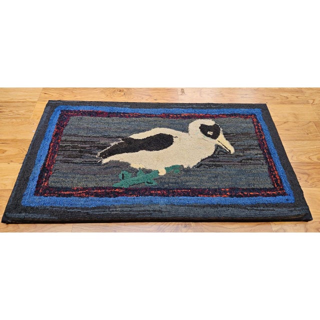 Vintage American hand hooked rug in a wonderful depiction of a DoDo bird. The rug has a delightful design and colors. We...