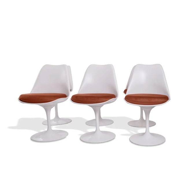 This set of six Eero Saarinen Tulip Side Chairs, produced by Bauhaus Italy, showcases the iconic pedestal silhouette that...