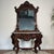 Beautiful vintage Rococo/Victorian Revival console table with matching wall mirror, featuring a dark, rich wood tone,...