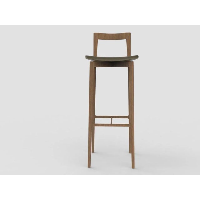 with its light and solid wood structure, this chair is suitable for contemporary interiors. Its proportions and reduced...