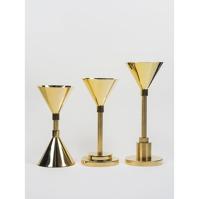 A precious chalice composed of several minimal, mechanical elements that relate to sacredness and everyday life;...
