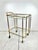 Vintage art deco style brass bar cart. Solid brass piping frame with rounded corners. Two glass shelves. On wheels.