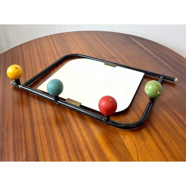 Charming French wall-mounted coat rack attributed to Roger Féraud, dating from the 1950s. Made of black lacquered tubular...