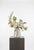 A light, airy arrangement featuring white tulips, cream dahlia, and delicate lilac sweet pea. Soft greenery and Queen...
