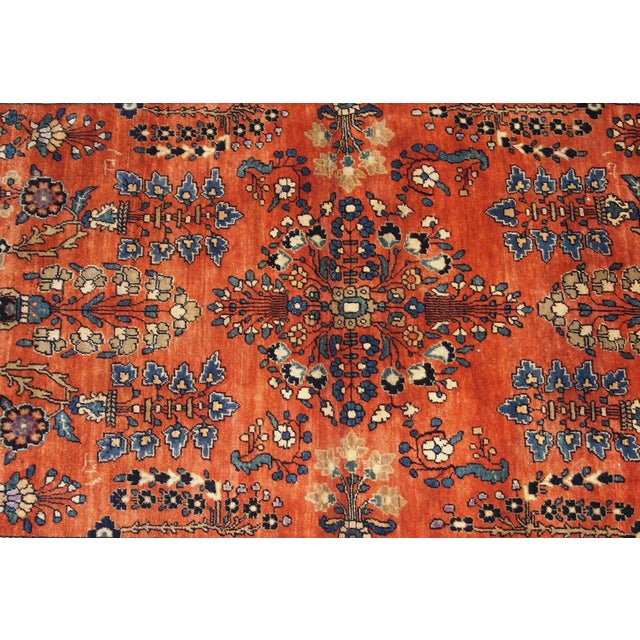 Handmade antique Persian Sarouk rug in original good condition. This rug is from the beginning of 20th century....