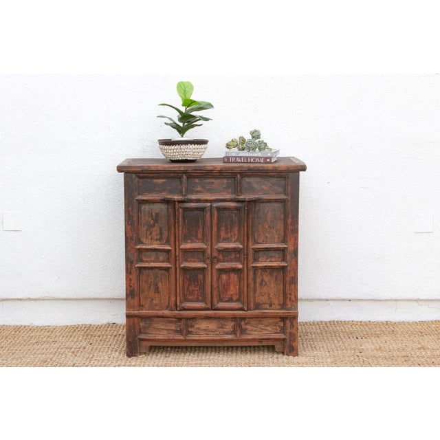 This antique cabinet, a classic example of Northern Chinese Provincial Cabinetry, carries a rich heritage from the late...