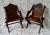 A stunning pair of oak glastonbury chairs with hand-carved inscription “esperang” meaning wait carved into the back,...