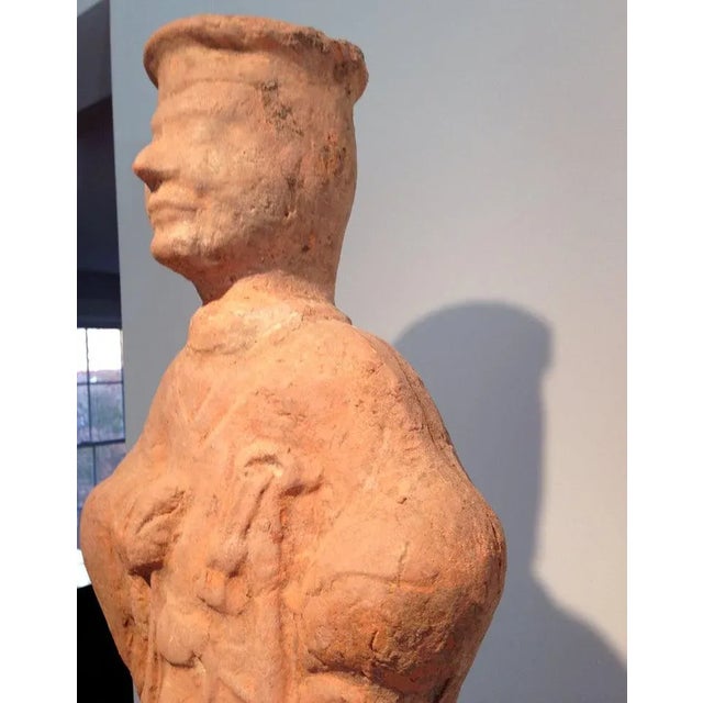 A Chinese terracotta tomb figure (Ni Yong) from East Han Dynasty (25-220 AD), likely from the area of nowadays Sichuan. It...