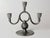 An expressive swedish three-light pewter candelabra by svenskt tenn, combining the elegance of art deco with the...