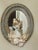 This is a lovely oval mirror. Painted a light blue, the original gold finish shows through in places where the blue has...