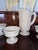 Collection of vintage milk glass. A pitcher, 4 dessert competes, three vases, and two shoes.