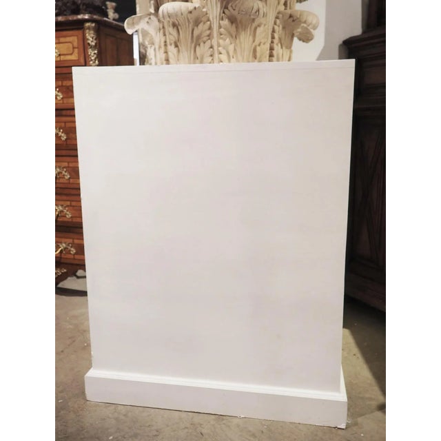 Worked in the Neoclassical style in France in the early 1900’s, this large plaster capital on wooden pedestal is of the...