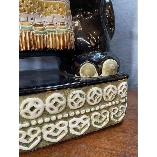 Absolutely unique terracotta elephant statue on display in our showroom. Glazed , multi color hand painted seat. In good,...