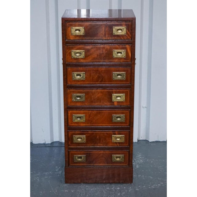 Antiques of London This handsome tallboy chest of drawers is crafted in the classic military campaign style, defined by...