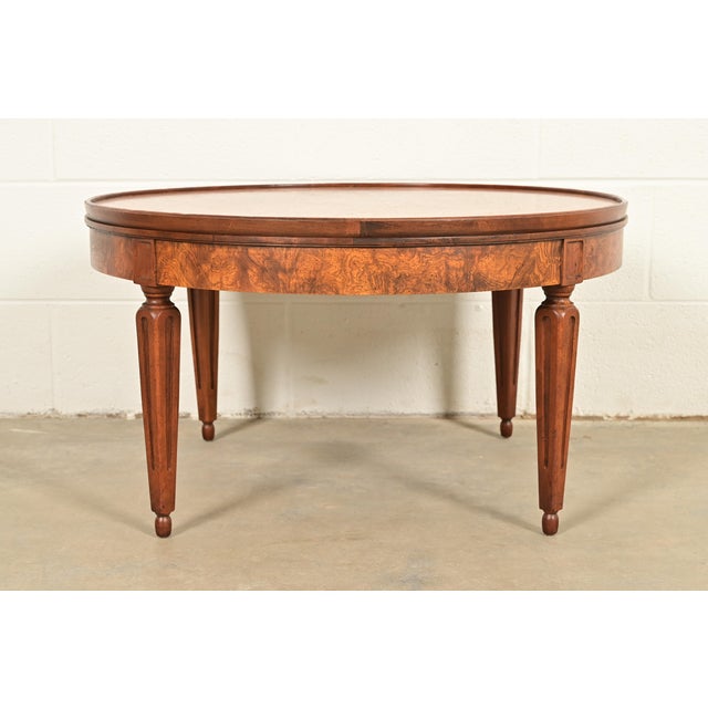 A gorgeous mid-century French Regency Louis XVI style coffee table, cocktail table, or tea table By Baker Furniture USA,...