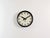 This wall clock was produced by Pragotron in former Czechoslovakia during the 1960s. It features a brown bakelite frame...
