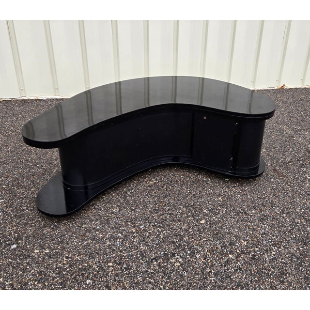 This boomerang coffee table and bar combo Attributed to A.H Stock. It is called a Grand Server. These were made for a slim...