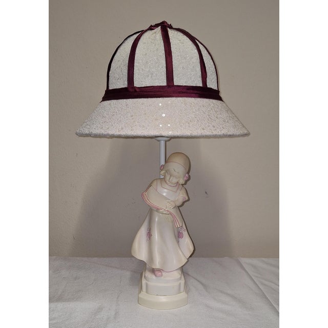 Vintage Italian Table Lamp Depicting a Reading Girl in Stonelite, 2000s, in Very Good conditions. Designed from 2000...