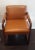 Great 1960/70s library armchair made of solid dark reddish wood with rounded edges. Upholstery is soft vinyl in a light...