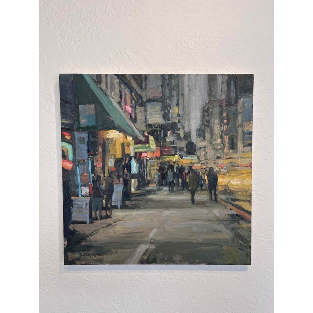 This oil on board painting captures a bustling urban scene at twilight, with figures strolling along the sidewalk under...