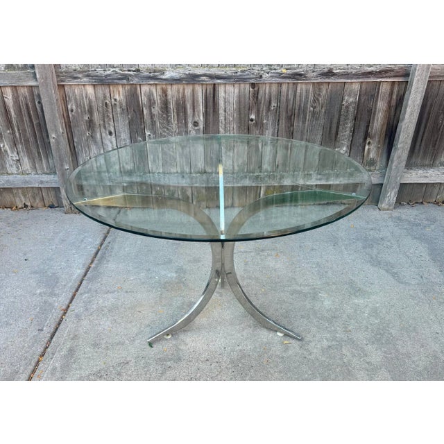 Vintage polished stainless steel table attributed to Boris Tabacoff. Unmarked, but online sources report this table base...