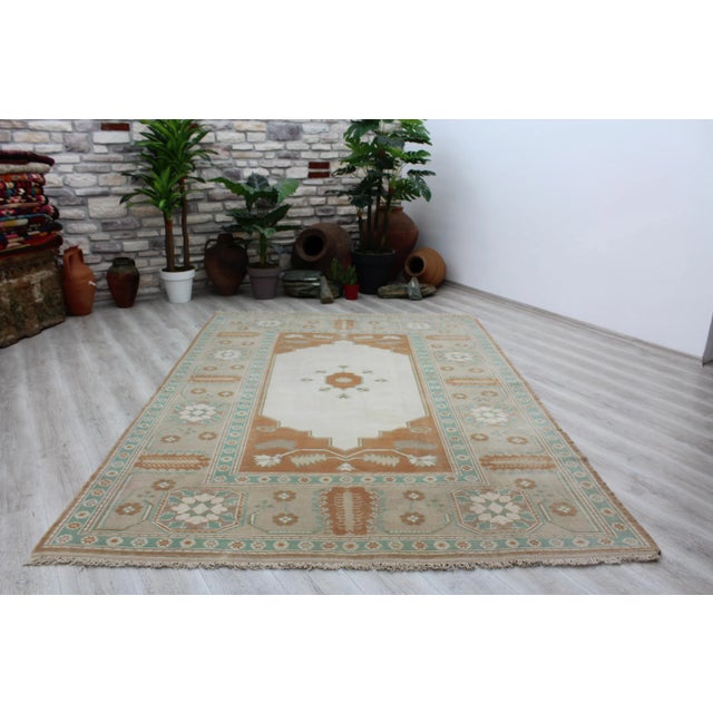 This gorgeous traditional hand knotted Vintage Anatolian area rug is approximately 60 years old in excellent vintage...
