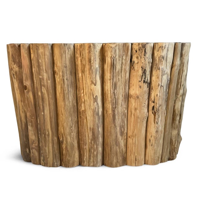 Striking rustic organic modern console table made of thick pieces of teak and topped with beautiful petrified wood....