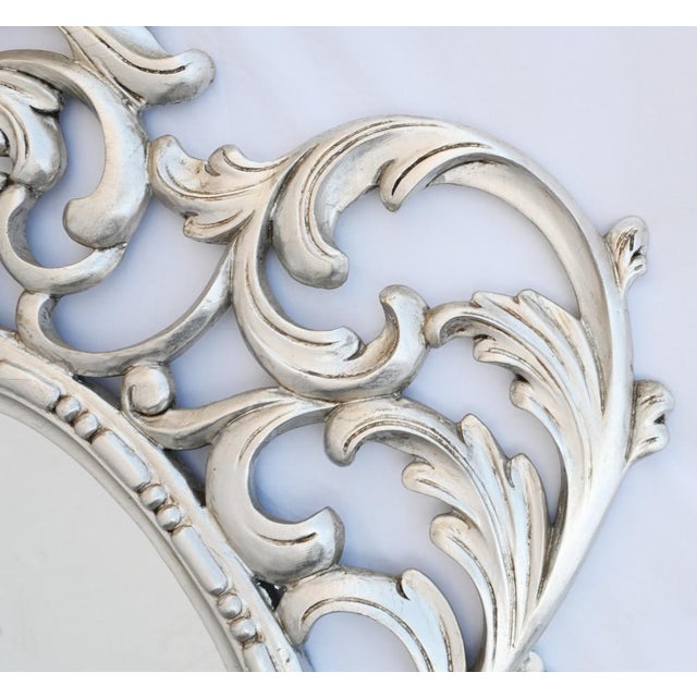 Elegant silver gilt oval mirror with elaborate rococo frame Such a great look to this piece and good size at almost five...