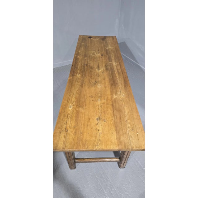 A super English three plank pine farmhouse table with elm base, two opening drawers to one side, waxed finish, honey...