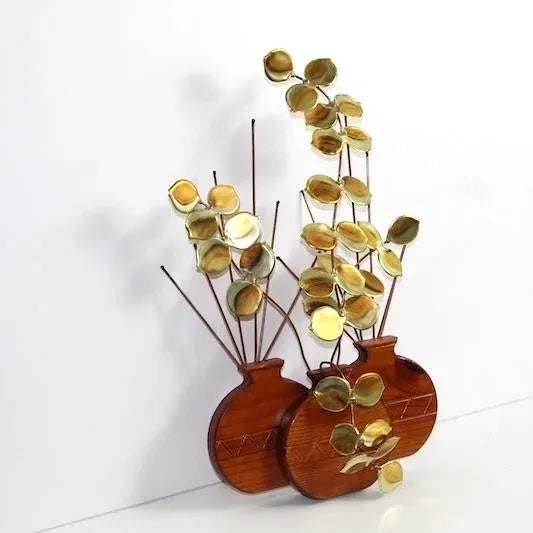 Vintage teak sculpture has 3 one-dimensional teak vases, each holding brass branches with round raindrop leaves, similar...